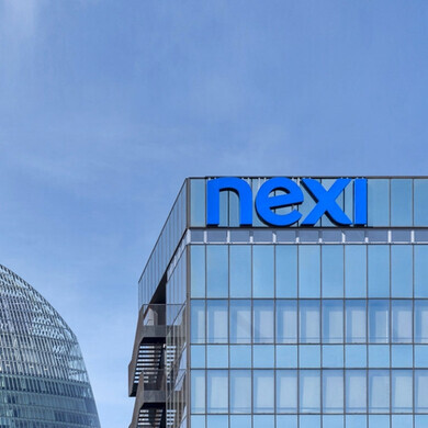 Edificio Nexi Vista esterna dell’edificio sede di Nexi, con logo visibile.