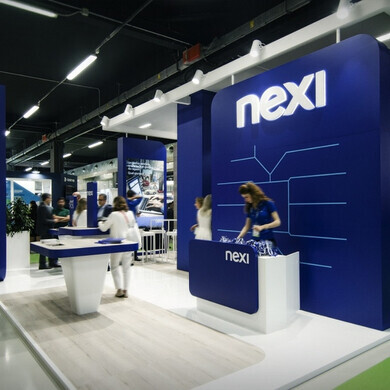 Stand Nexi allestito per eventi o fiere, con materiale promozionale.