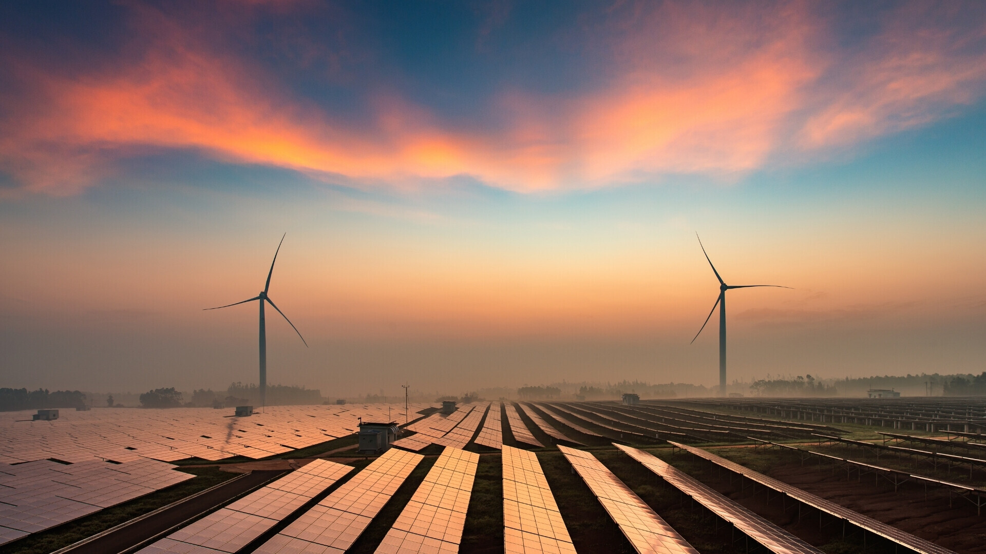 Pannelli solari e pale eoliche Pannelli solari affiancati da pale eoliche in un impianto di energia rinnovabile