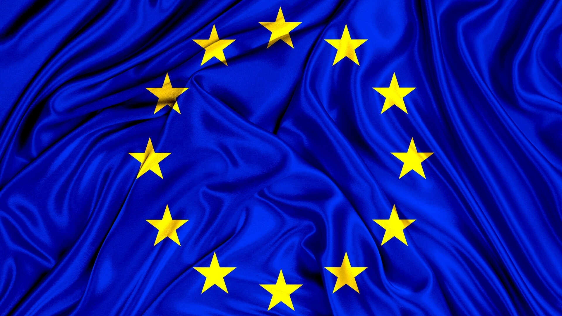 Bandiera dell’Unione Europea su sfondo blu elettrico con cerchio di dodici stelle dorate.