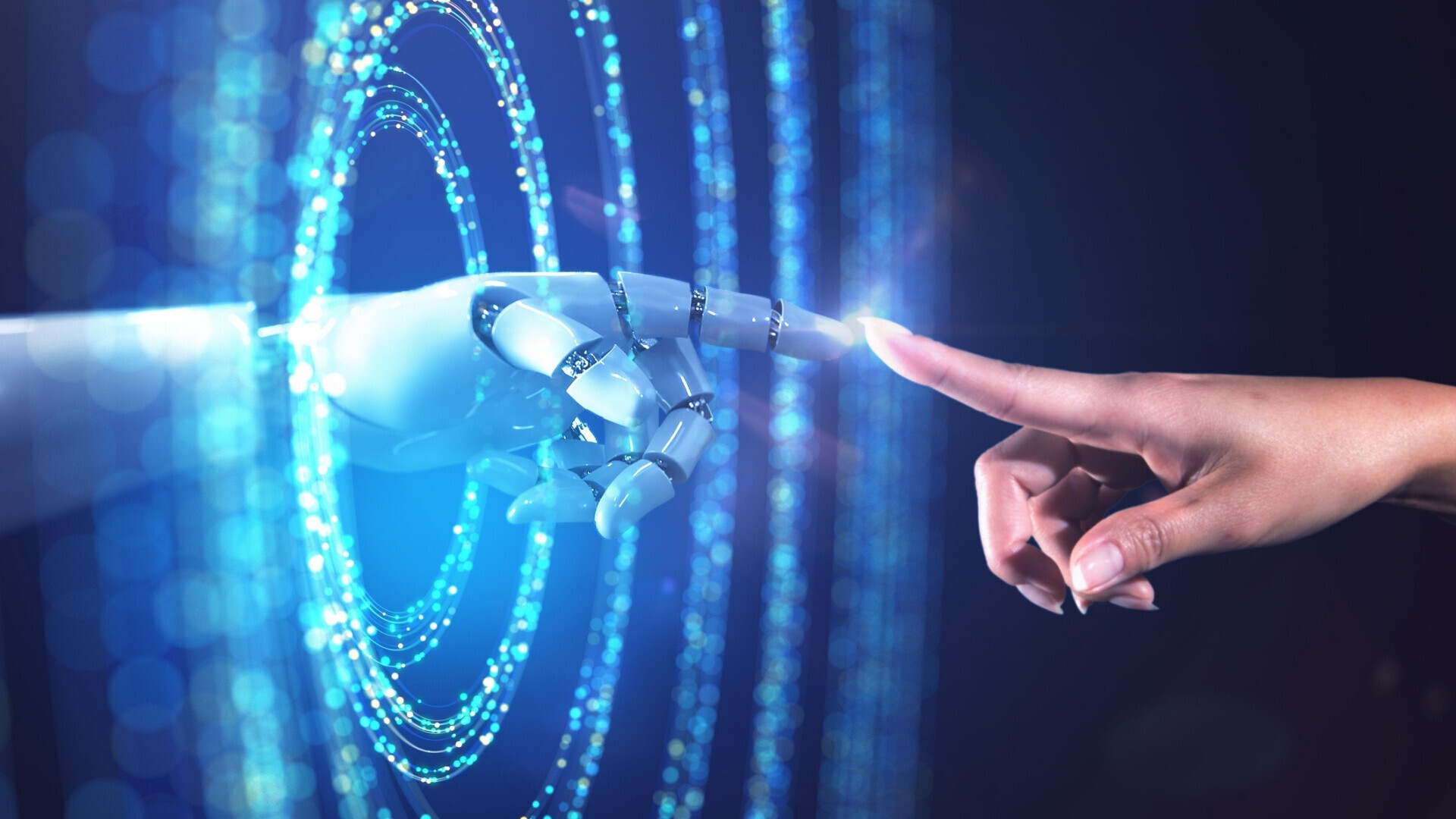 Immagine astratta di una mano femminile che accede al mondo digitale dal mondo reale.